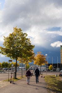 a couple walking on a sidewalk