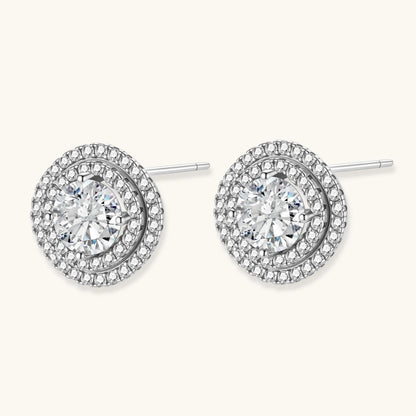 Double halo sterling silver stud earrings with brilliant round moissanite center stones and pavé crystal accents