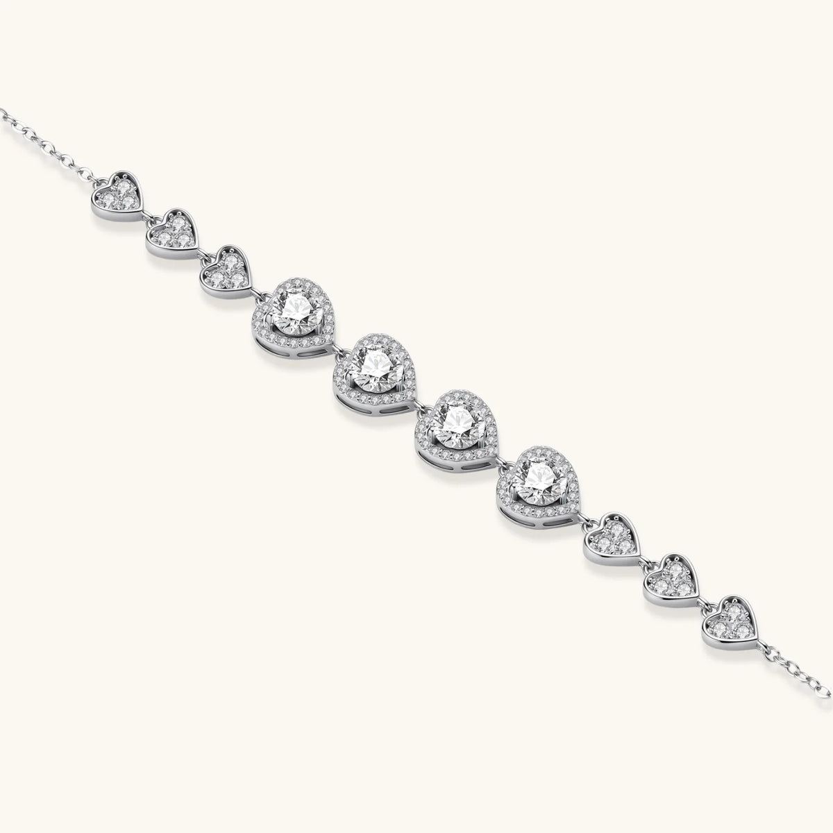 Complete jewelry set with heart-shaped sterling silver pieces featuring brilliant moissanite stones on white background.
